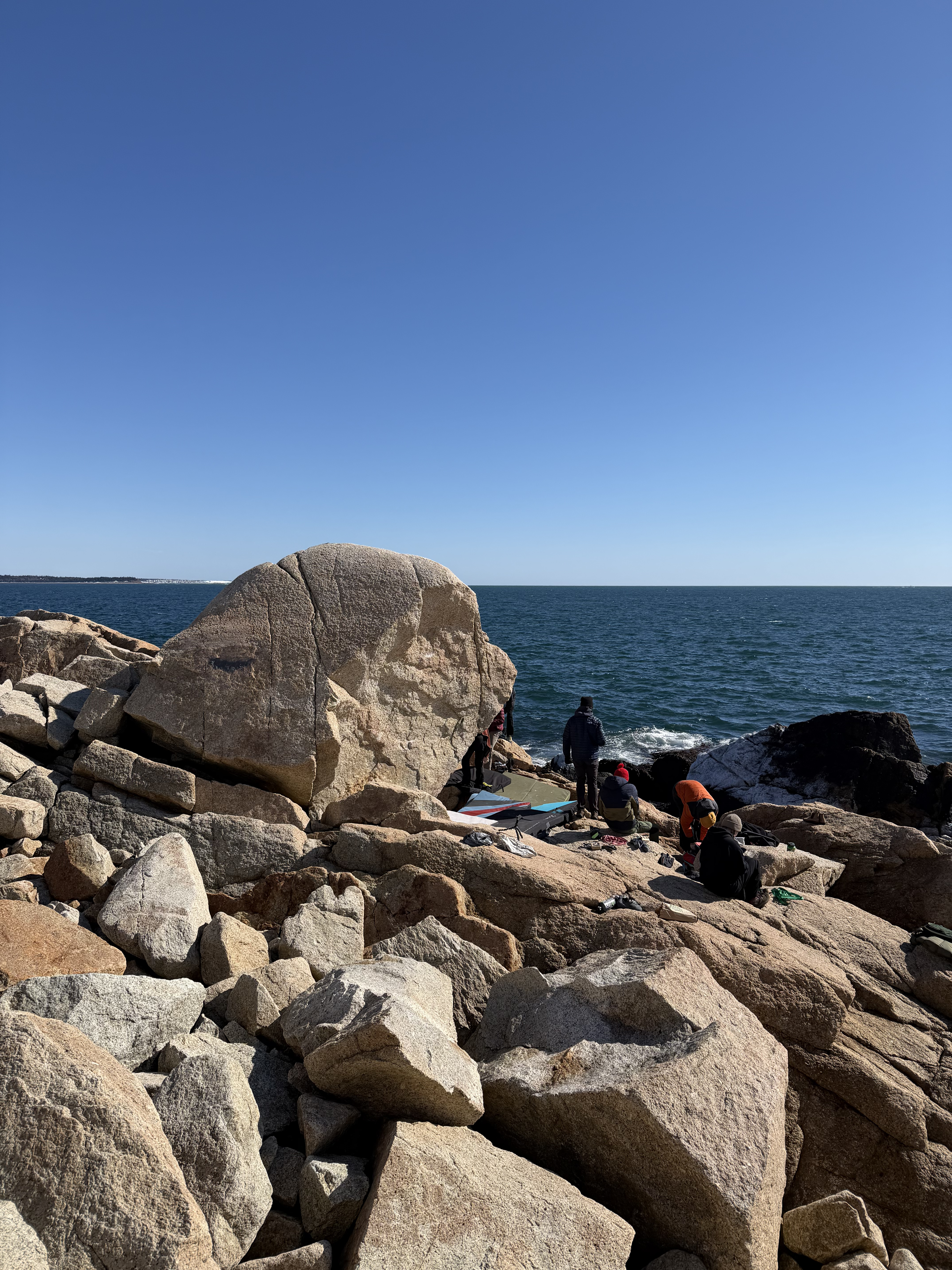 Climbers in front of Mole Boulder at Herring Cove